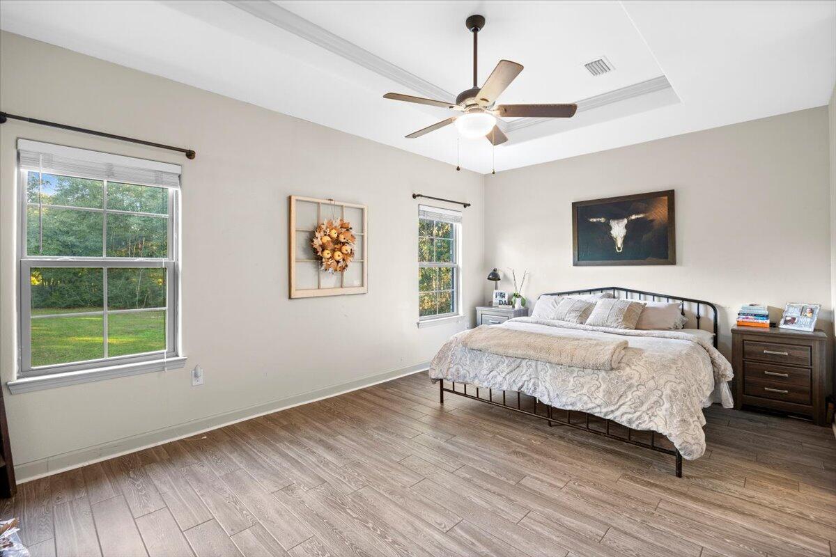 6057 Diamante Drive Crestview, FL 32539 - Photo 18 of 33 a spacious bedroom with a large bed and a window