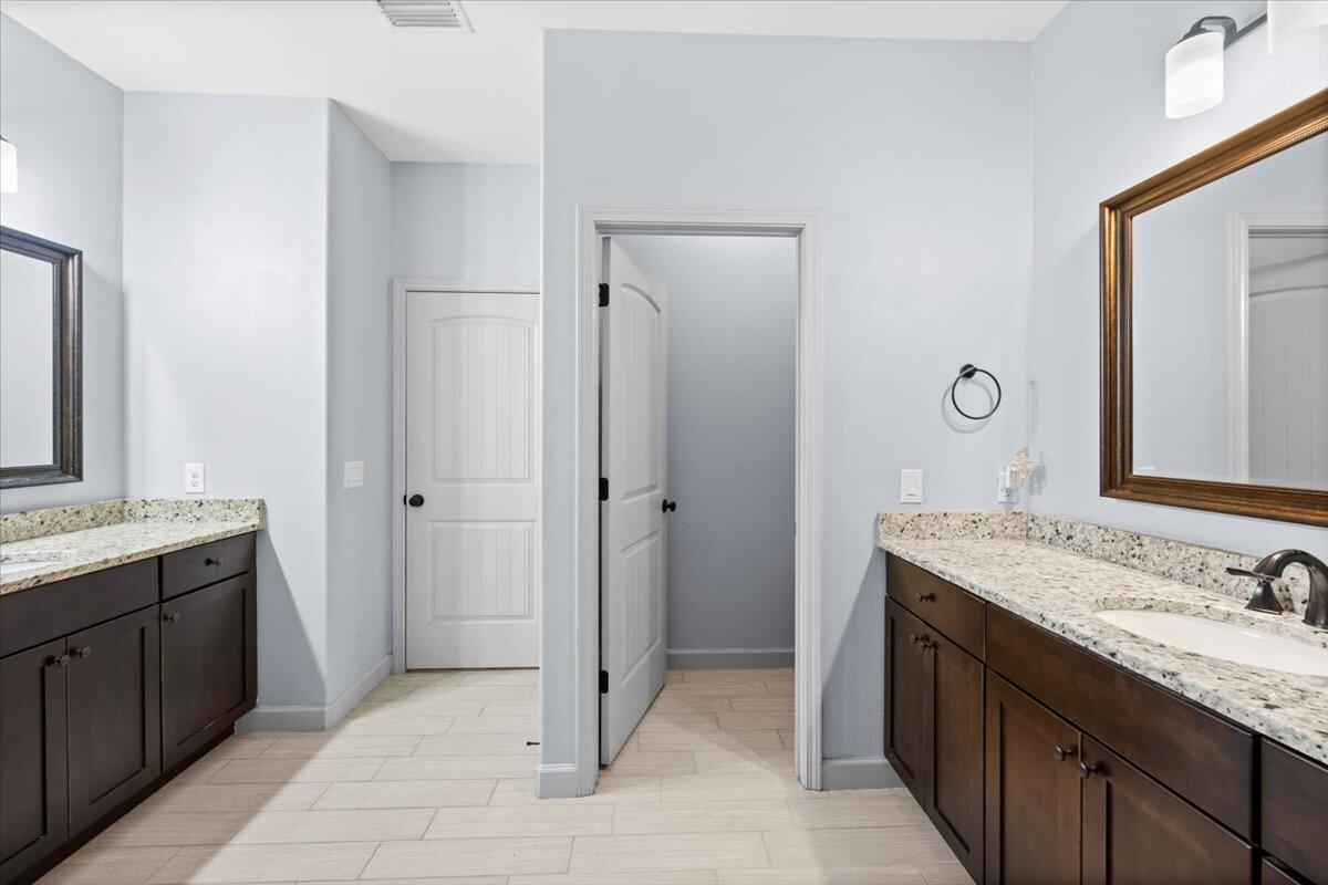 6057 Diamante Drive Crestview, FL 32539 - Photo 20 of 33 a bathroom with a sink and a mirror