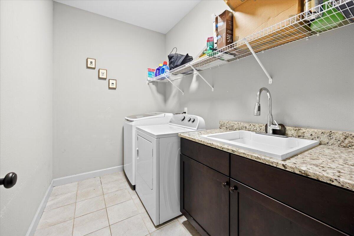 6057 Diamante Drive Crestview, FL 32539 - Photo 31 of 33 a utility room with a sink dryer and washer