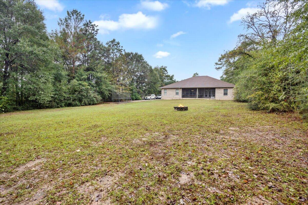 6057 Diamante Drive Crestview, FL 32539 - Photo 33 of 33 a view of an outdoor space and a yard