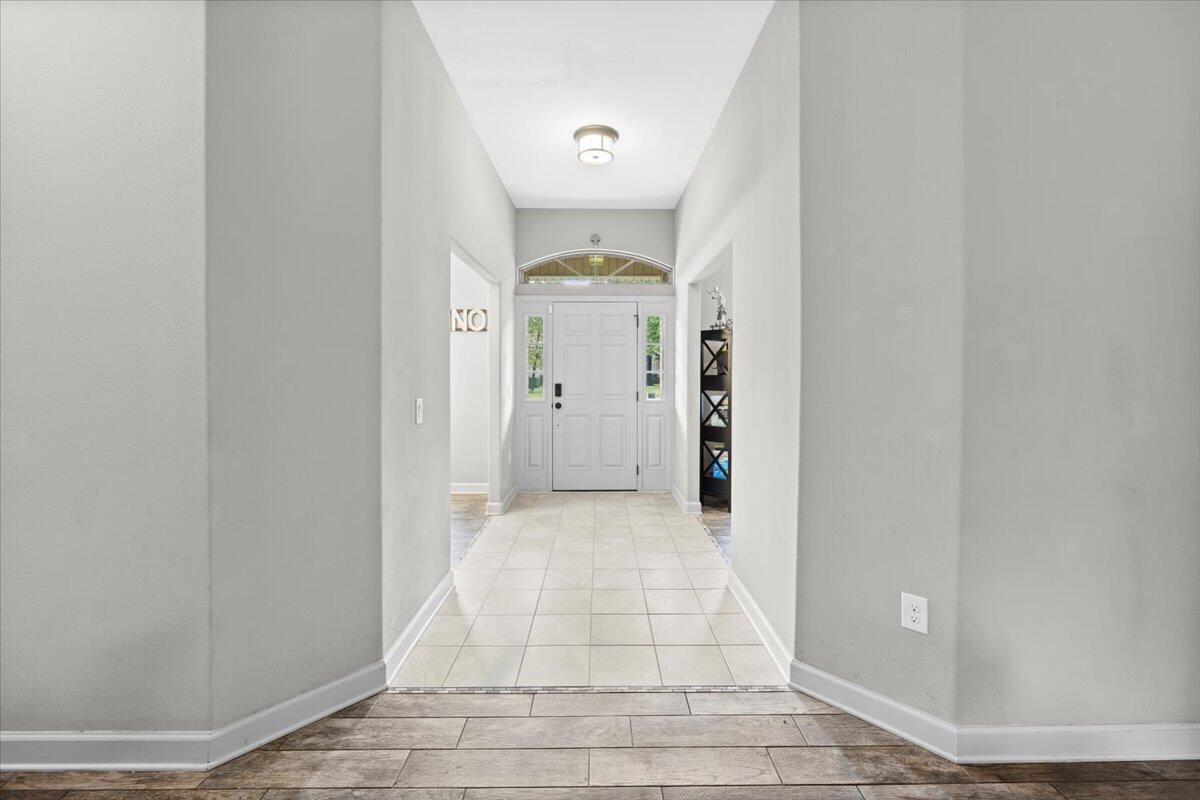 6057 Diamante Drive Crestview, FL 32539 - Photo 5 of 33 a view of a hallway with windows