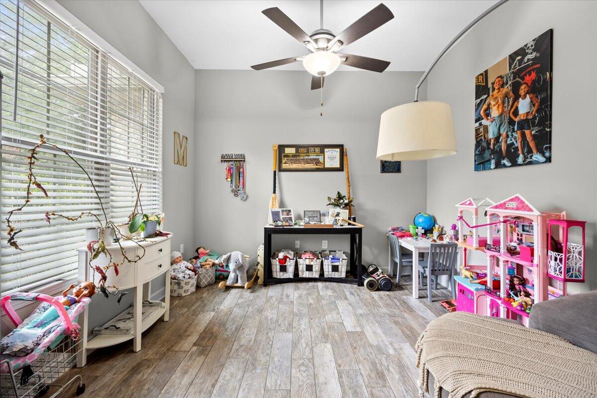6057 Diamante Drive Crestview, FL 32539 - Photo 7 of 33 a living room with furniture and a wooden floor