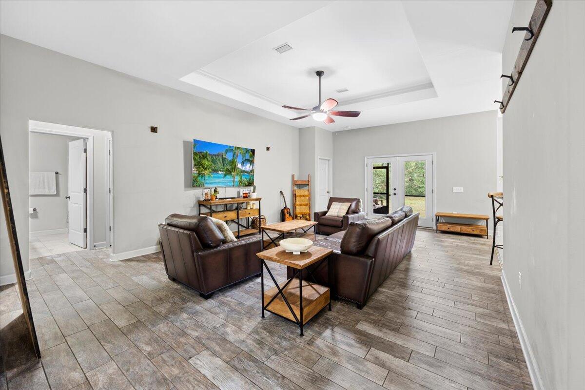 6057 Diamante Drive Crestview, FL 32539 - Photo 8 of 33 a living room with furniture and a flat screen tv