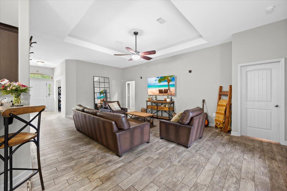 6057 Diamante Drive Crestview, FL 32539 - Photo 9 of 33 a living room with furniture and a flat screen tv