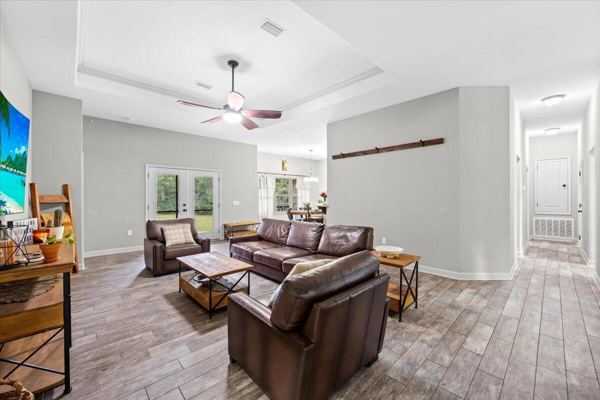6057 Diamante Drive Crestview, FL 32539 - Photo 10 of 33 a living room with furniture and a wooden floor