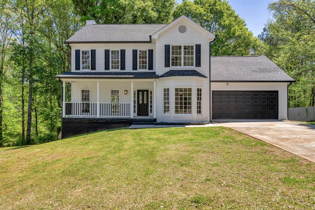 front view of a house with a yard