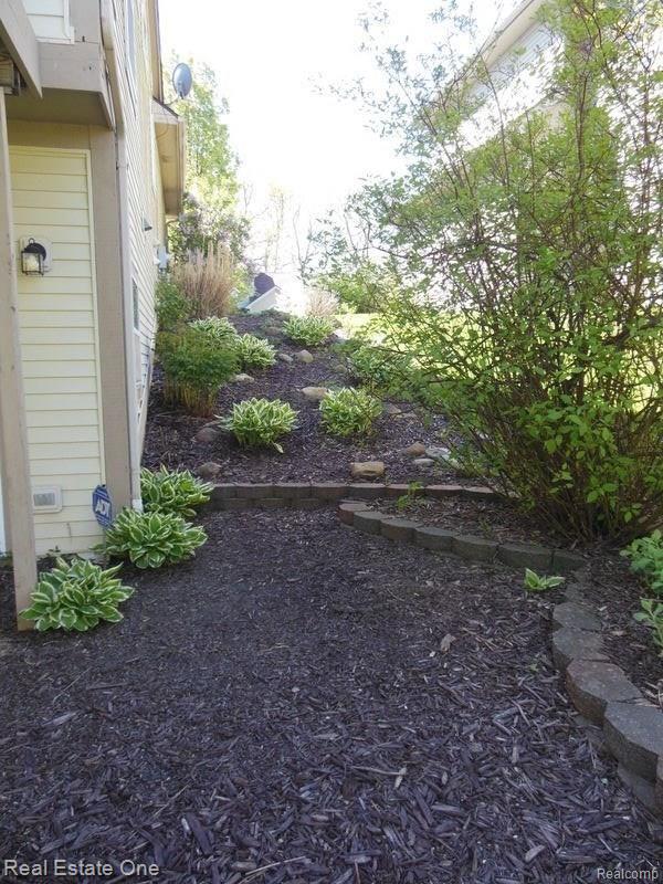 2539 Ravine Side North Howell, MI 48843 - Photo 10 of 43 Mature Landscaping