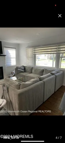 a view of a kitchen with furniture and fireplace