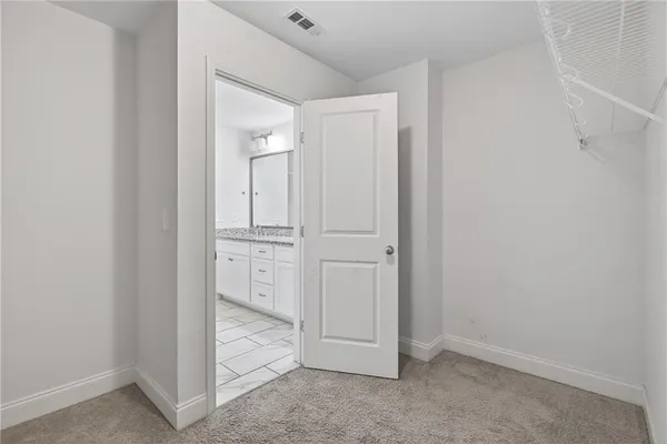 a bedroom with a bed and a cabinets