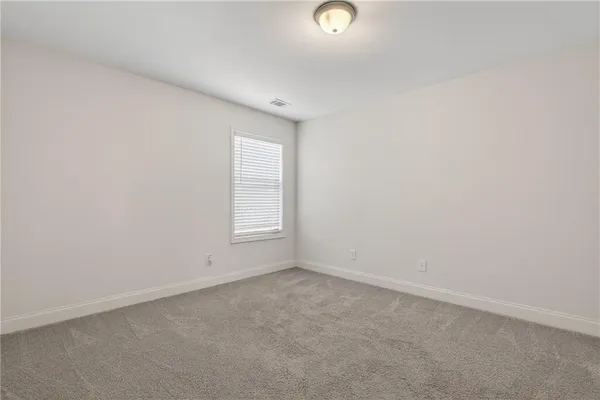 a view of an empty room with a sliding door