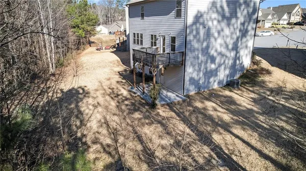 an aerial view of a house with swimming pool
