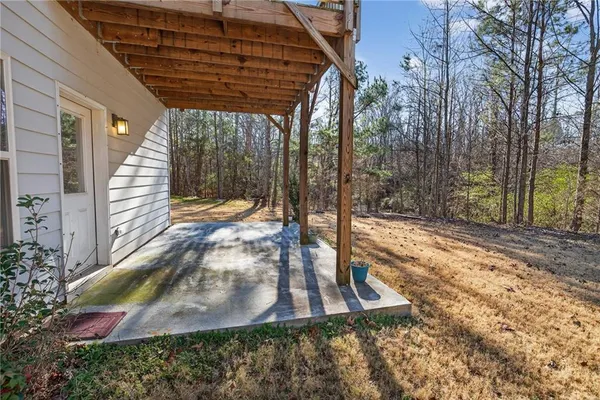 an aerial view of a house with outdoor space