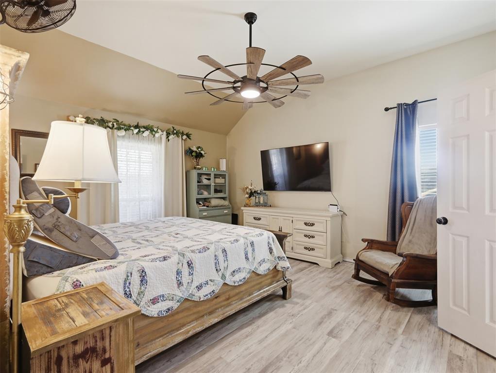 3823 State Highway Bonham, TX 75418 - Photo 12 of 37 a bedroom with a bed and a flat screen tv