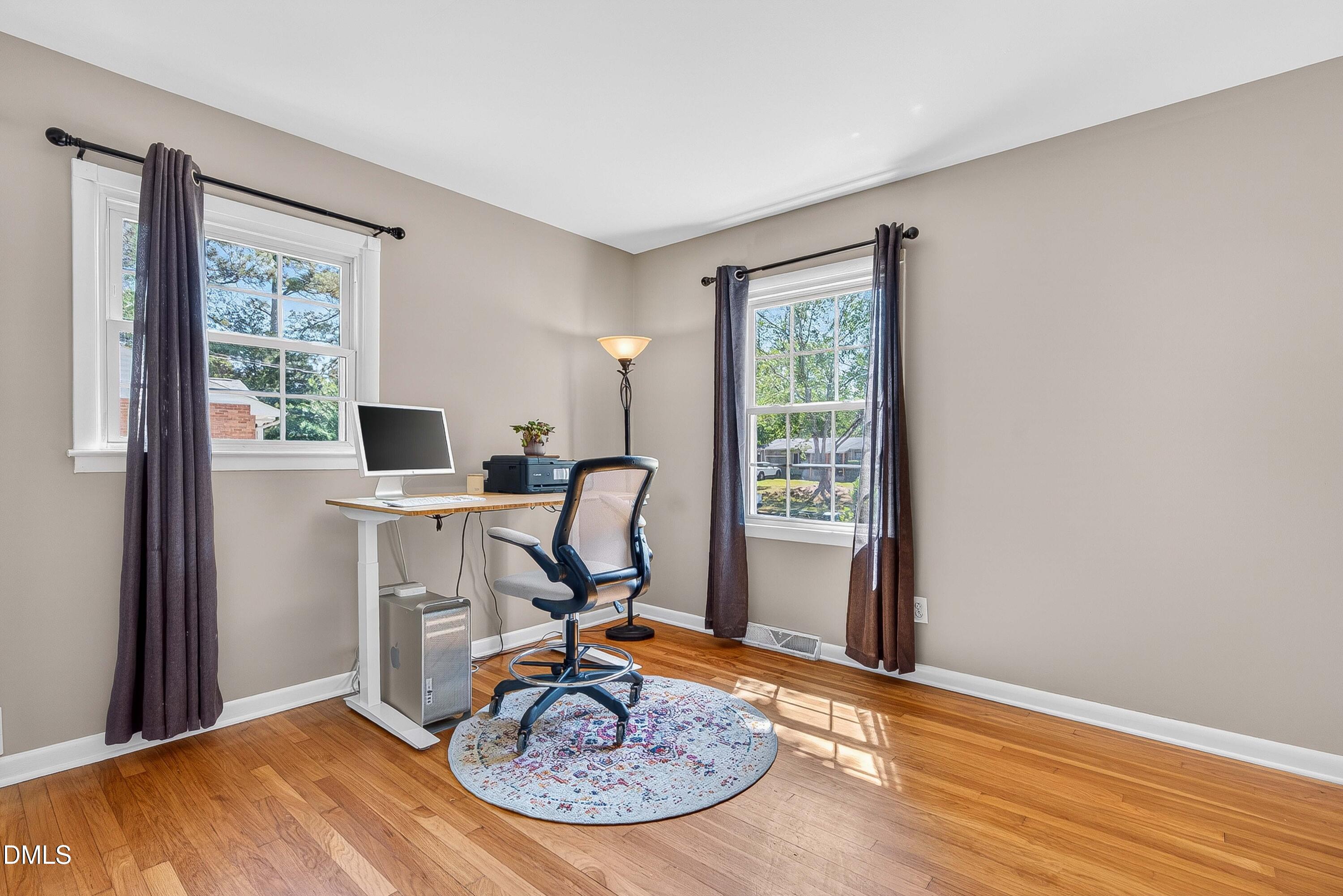 110 Temple Lane Durham, NC 27713 - Photo 16 of 27 a view of a workspace with furniture and a window
