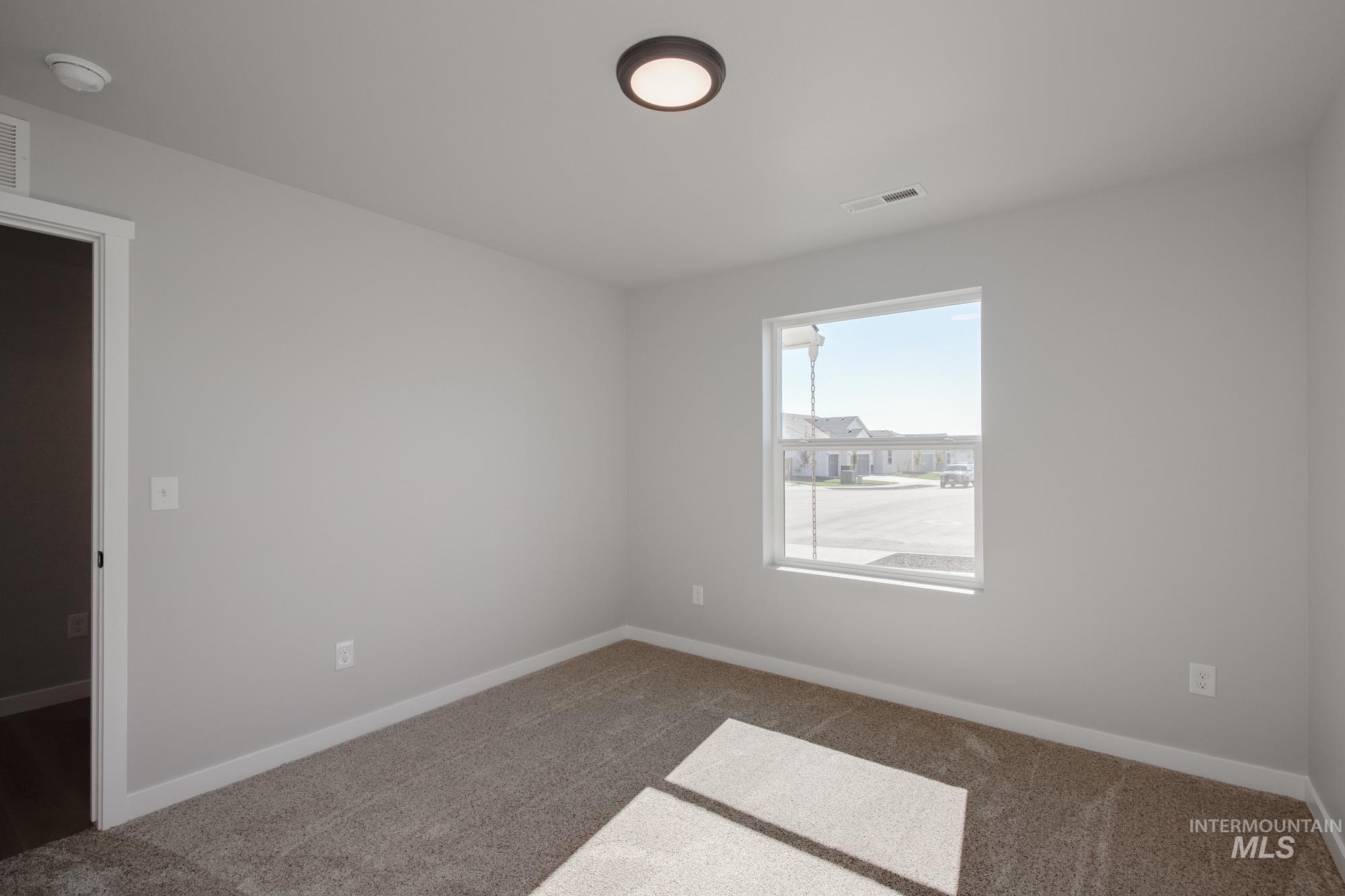 13727 Judson Street Caldwell, ID 83607 - Photo 15 of 26 Spare room with baseboards and carpet floors