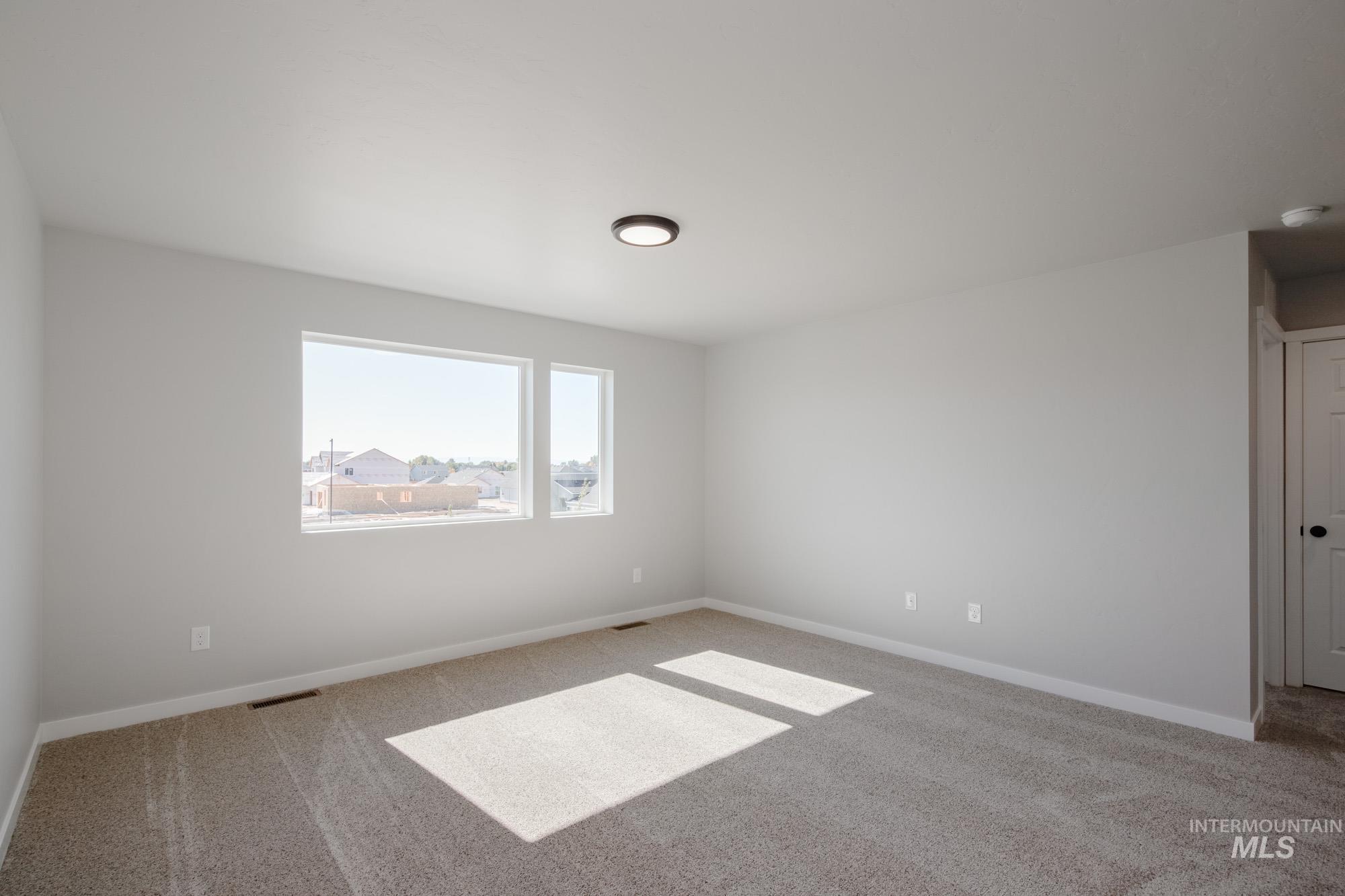 13727 Judson Street Caldwell, ID 83607 - Photo 19 of 26 Carpeted spare room featuring baseboards