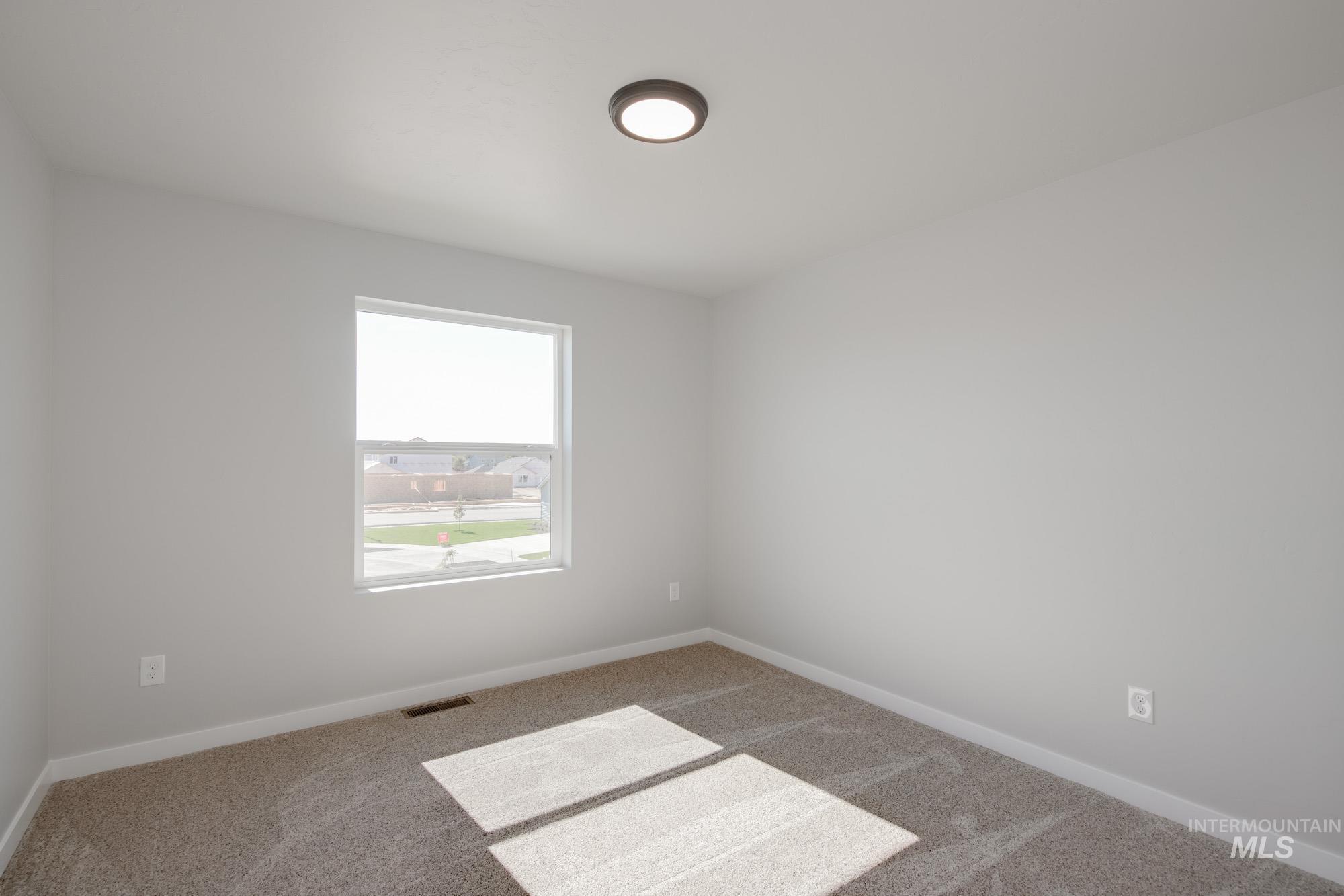 13727 Judson Street Caldwell, ID 83607 - Photo 21 of 26 Spare room featuring carpet