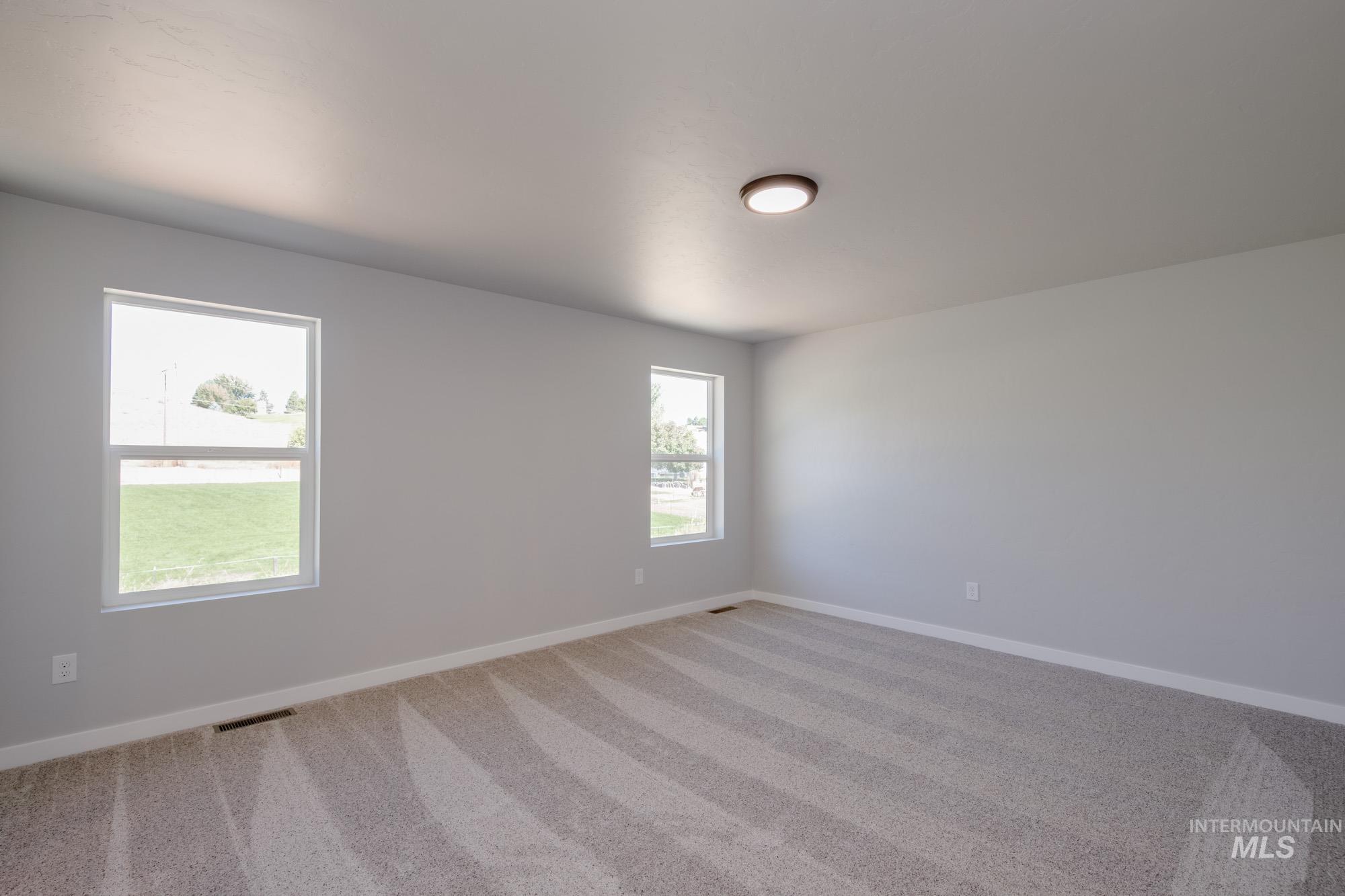 13727 Judson Street Caldwell, ID 83607 - Photo 23 of 26 Carpeted spare room featuring baseboards