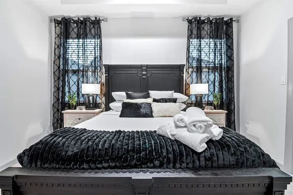 a bedroom with a bed and window