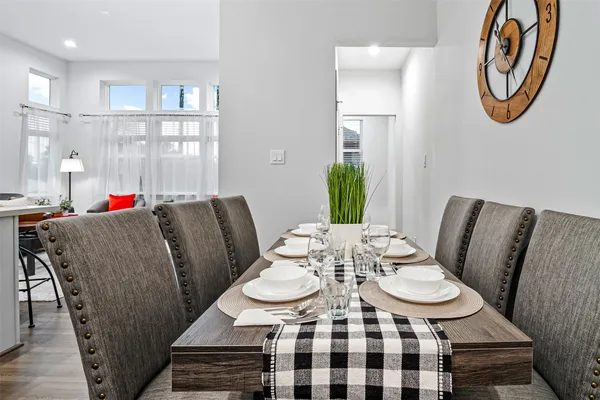 a view of a dining room with furniture window and wooden floor