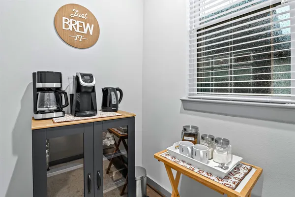 a view of a workspace with furniture