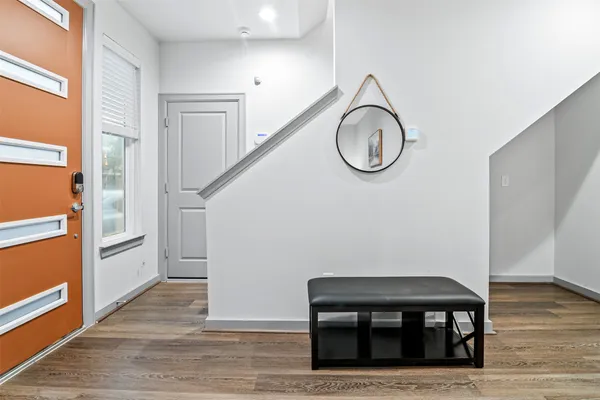 a view of wooden floor and utility in a room