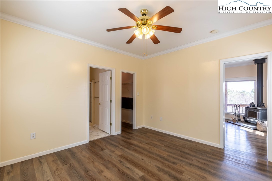 449 Meadow Ridge Drive Jefferson, NC 28640 - Photo 18 of 37 a view of an empty room with window and wooden floor