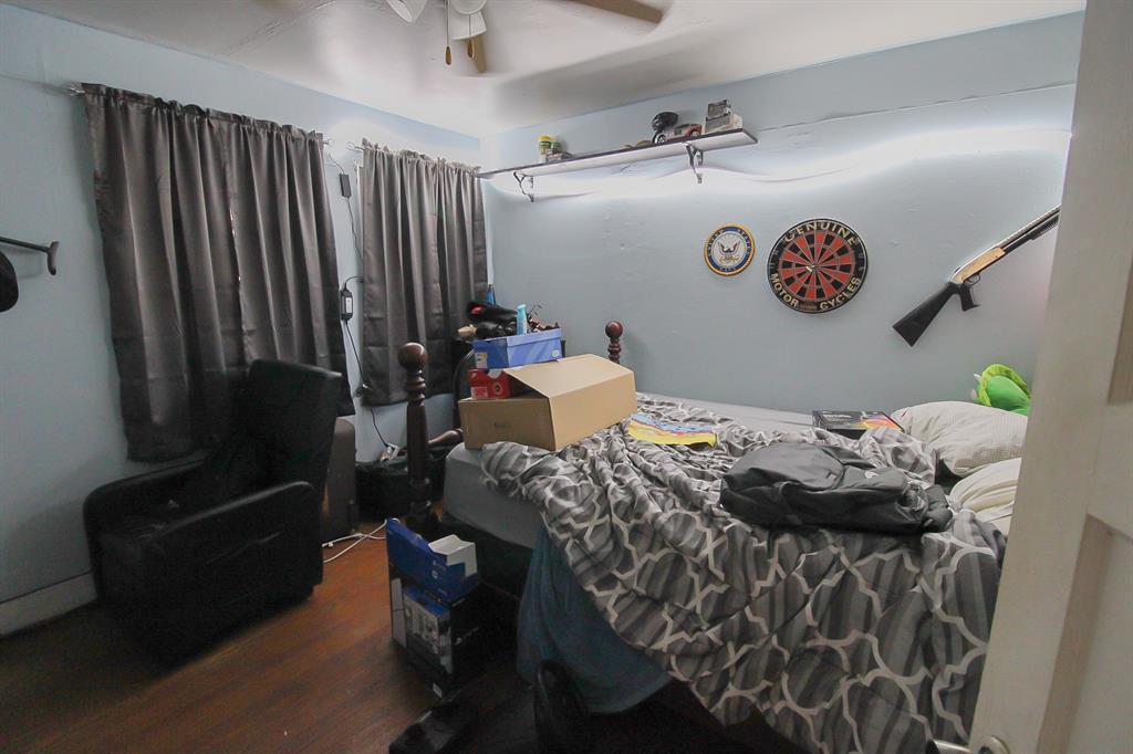 204 Roosevelt Hooks, TX 75561 - Photo 10 of 11 a bedroom with a bed and a table in it