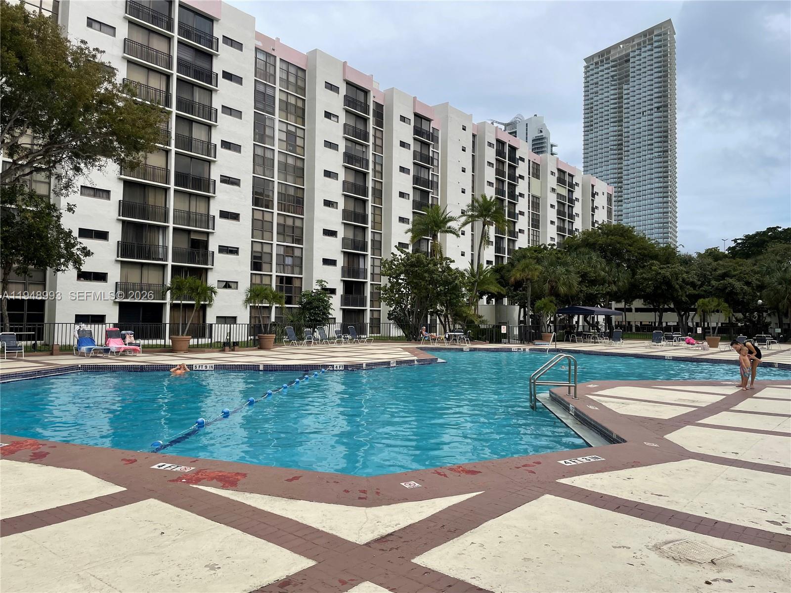 16919 North Bay Road, Unit 104 Sunny Isles Beach, FL 33160 - Photo 28 of 32 a view of swimming pool with outdoor space