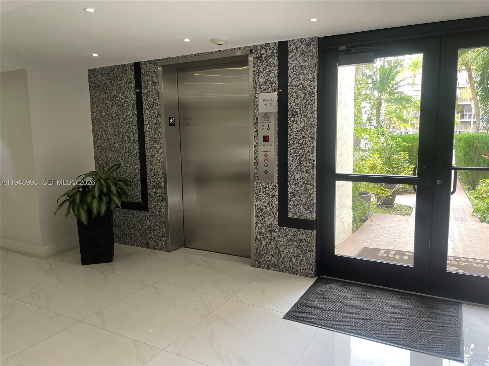 16919 North Bay Road, Unit 104 Sunny Isles Beach, FL 33160 - Photo 32 of 32 a view of entryway with a garden