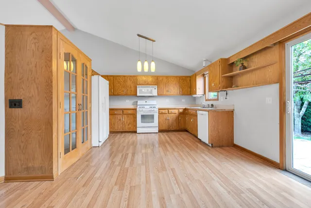 a view of kitchen with wooden floor