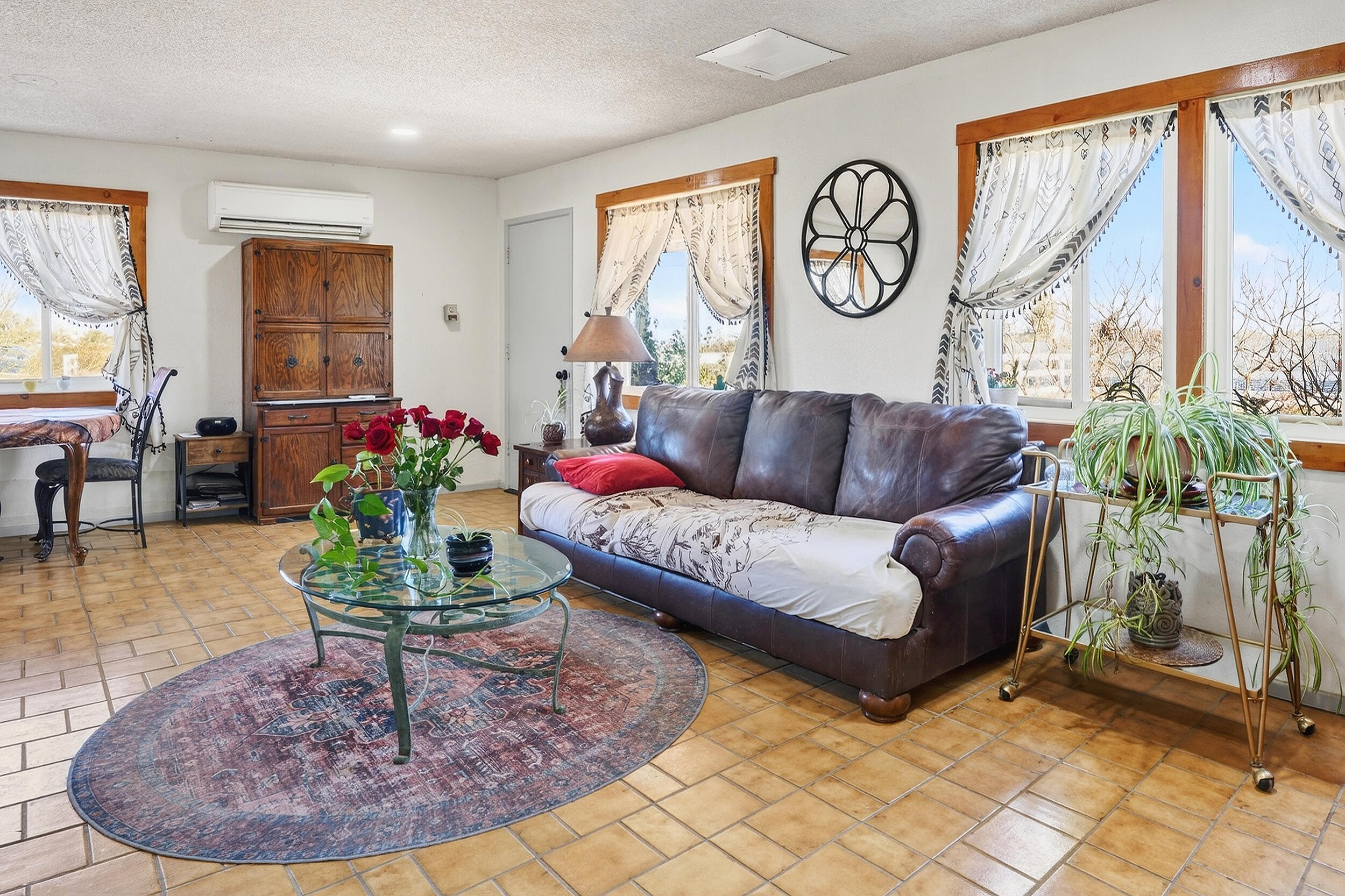 1588 Old Woman Springs Road Yucca Valley, CA 92284 - Photo 11 of 37 a living room with furniture and a large window