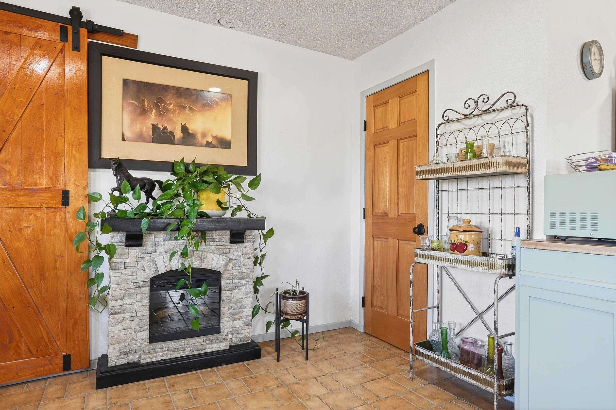 1588 Old Woman Springs Road Yucca Valley, CA 92284 - Photo 19 of 37 a living room with furniture and a fireplace