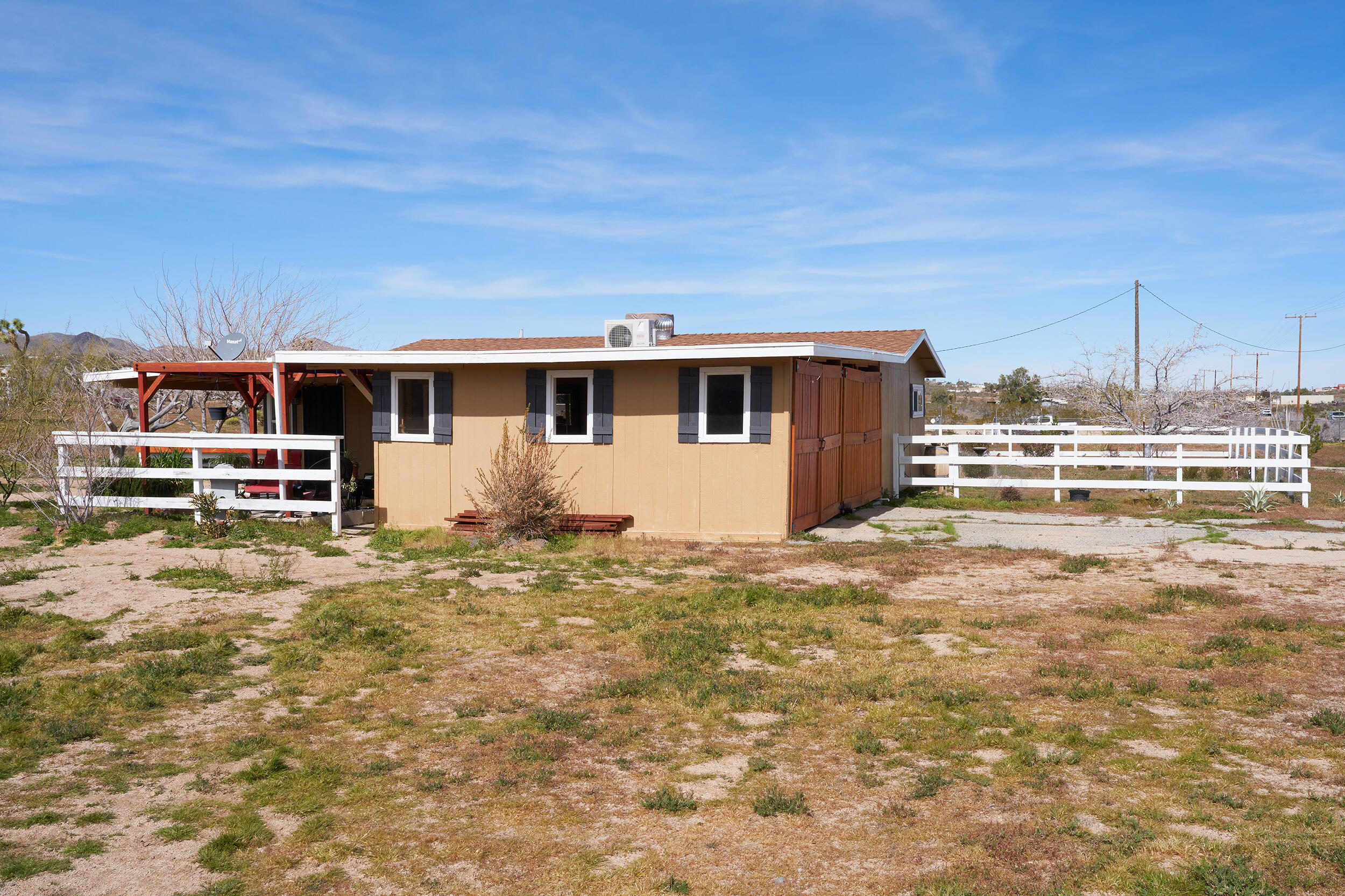 1588 Old Woman Springs Road Yucca Valley, CA 92284 - Photo 2 of 37 a view of a house with a backyard