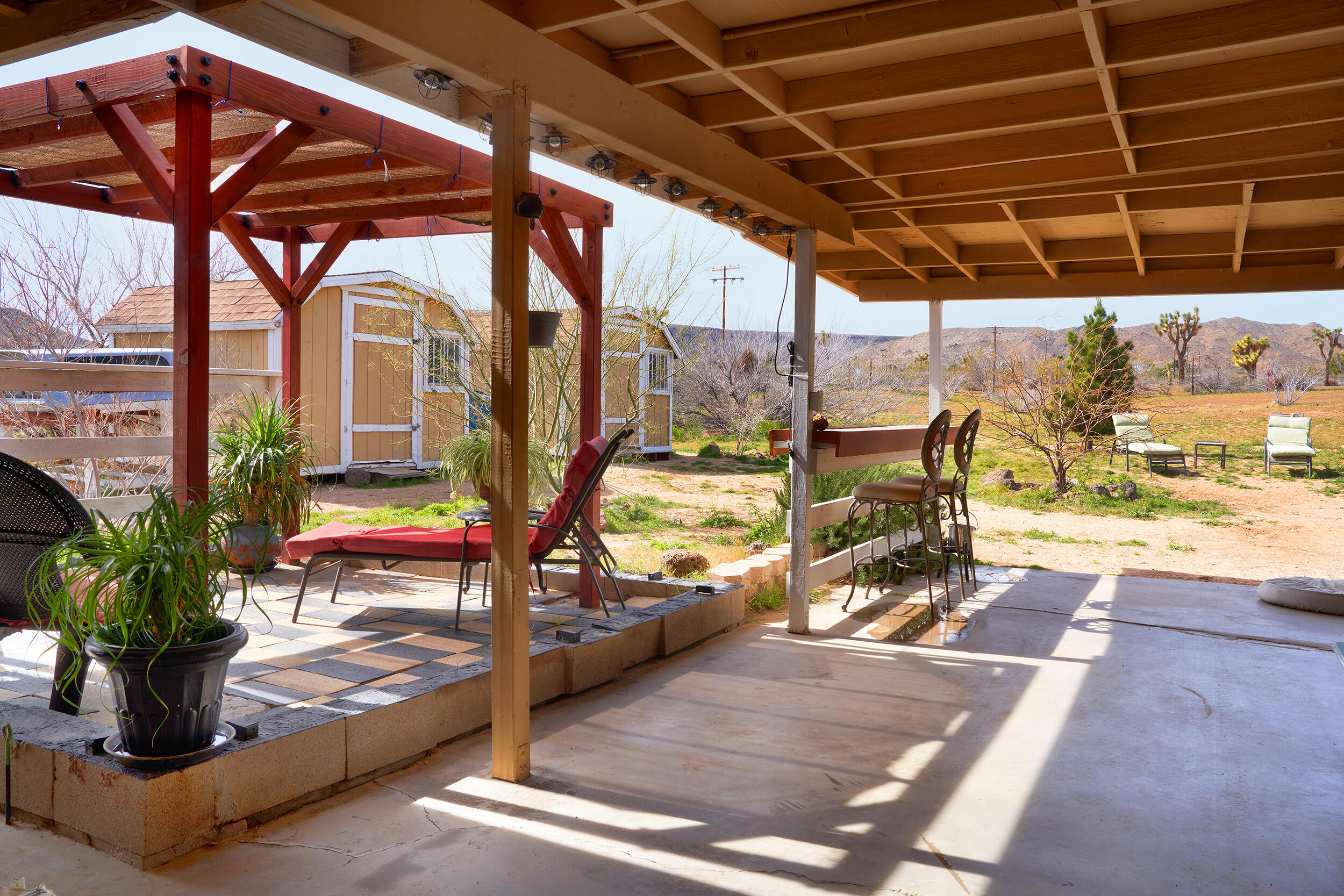 1588 Old Woman Springs Road Yucca Valley, CA 92284 - Photo 5 of 37 a view of a swimming pool with a patio