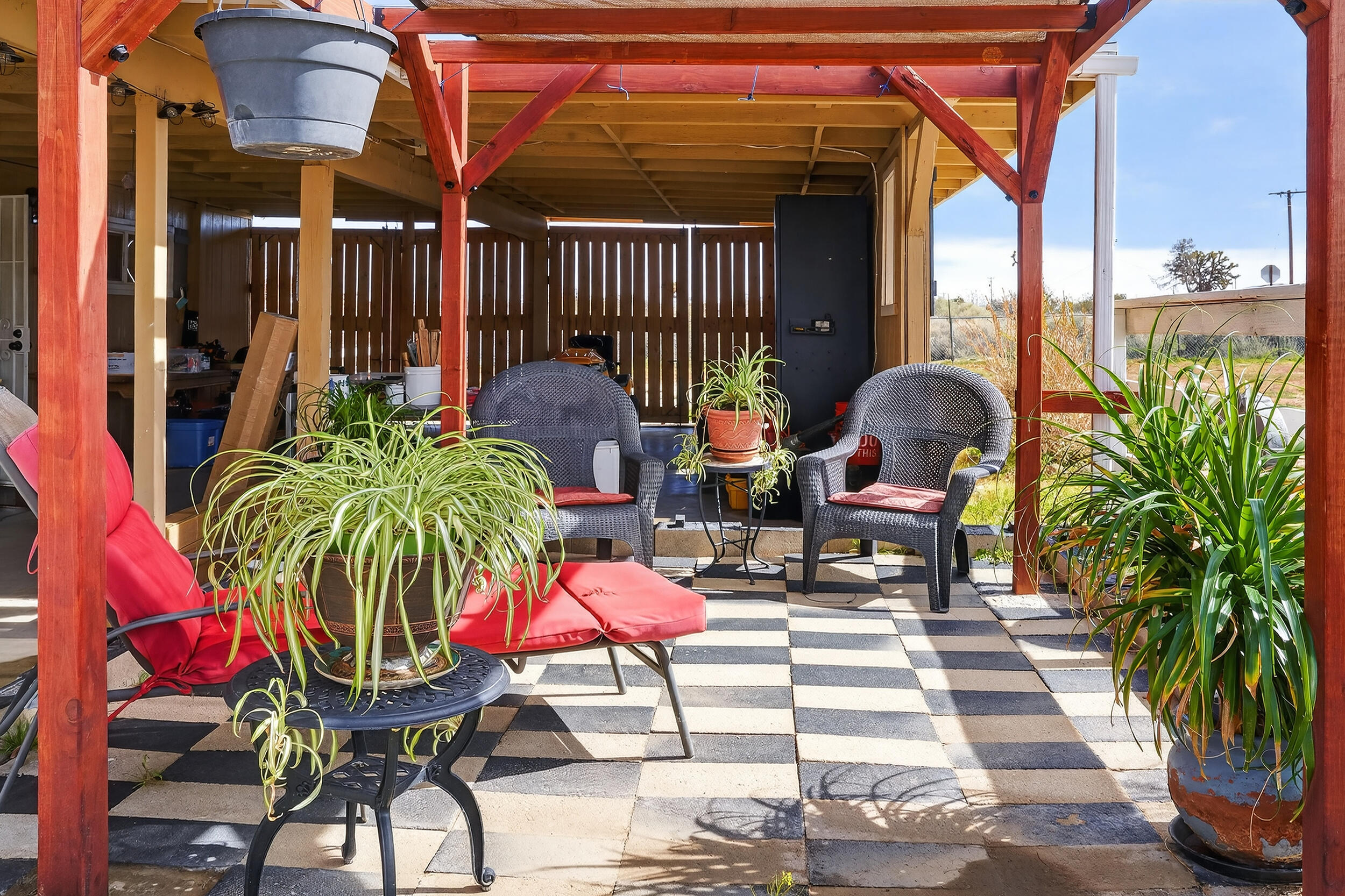 1588 Old Woman Springs Road Yucca Valley, CA 92284 - Photo 6 of 37 a view of balcony with two chairs and a potted plant