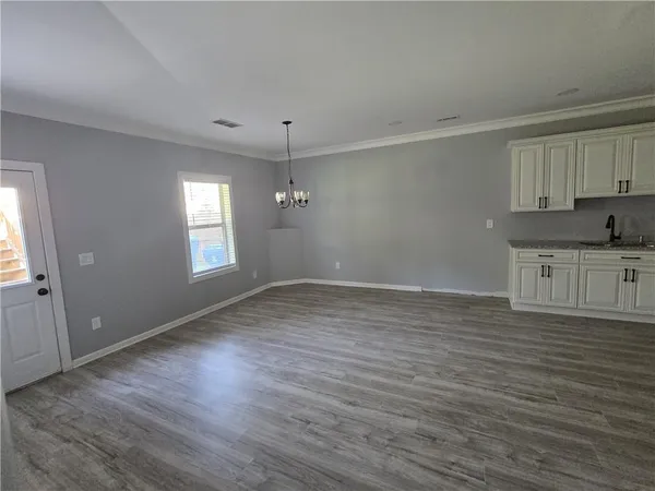 a view of wooden floor in an empty room
