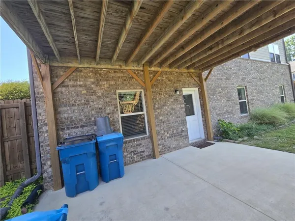 a view of balcony with wooden floor and fence