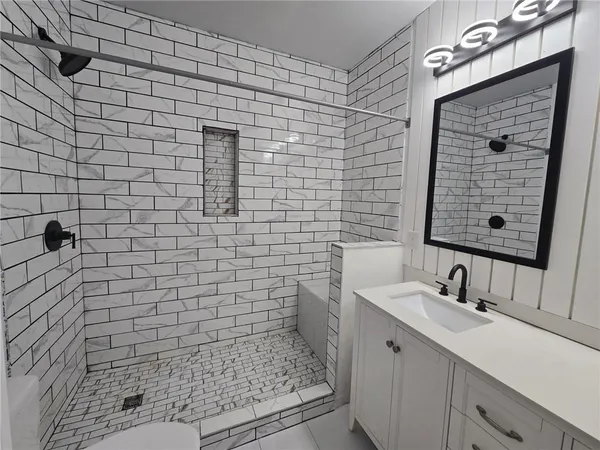 a view of a hallway with washer and dryer