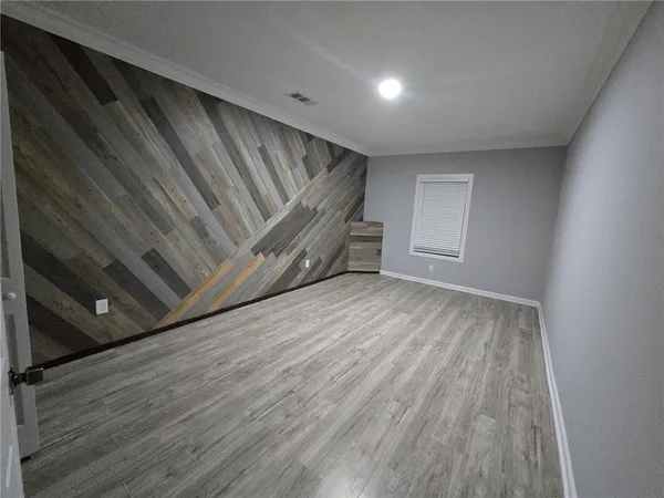 a kitchen with kitchen island granite countertop a stove a sink a refrigerator and a microwave