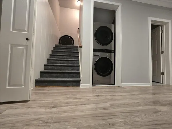 a large kitchen with stainless steel appliances granite countertop a stove a sink and a refrigerator