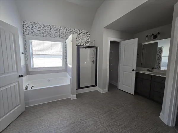 an empty room with closet and mirror