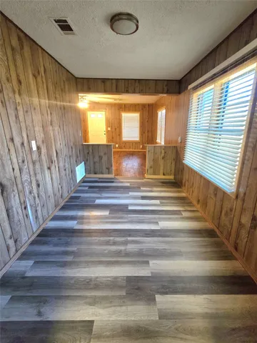 a spacious bathroom with a sink a large mirror and a shower