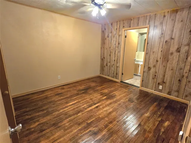 a bathroom with a shower a toilet and a window