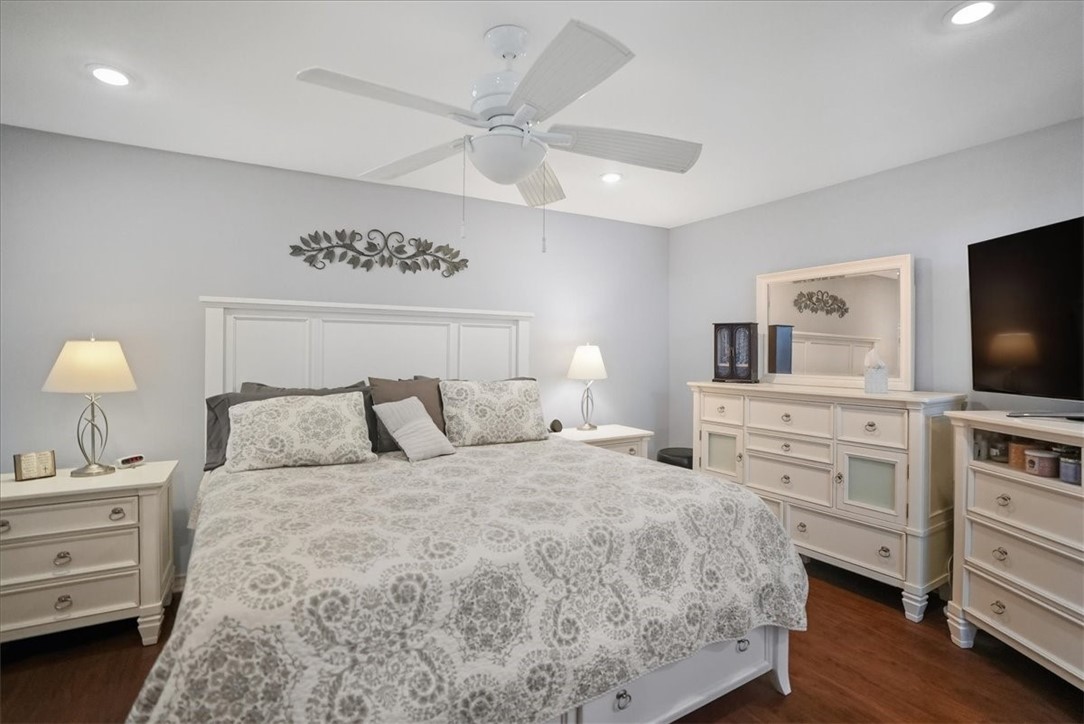 4218 Beard Drive Corpus Christi, TX 78413 - Photo 16 of 31 a bedroom with a bed and a flat screen tv