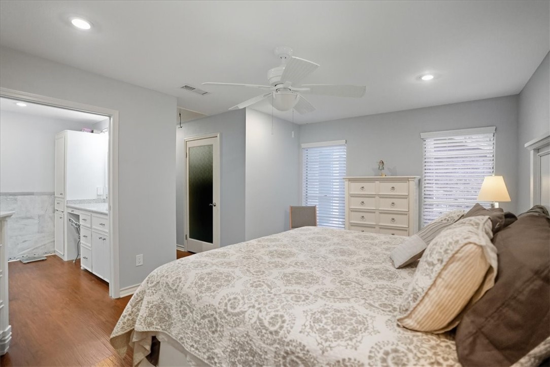 4218 Beard Drive Corpus Christi, TX 78413 - Photo 18 of 31 a bedroom with a bed and a refrigerator