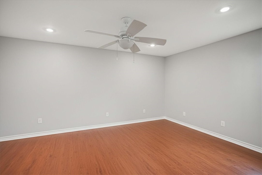 4218 Beard Drive Corpus Christi, TX 78413 - Photo 19 of 31 an empty room with wooden floor and fan