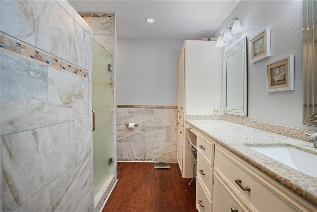 4218 Beard Drive Corpus Christi, TX 78413 - Photo 20 of 31 a bathroom with a granite countertop sink a mirror and shower