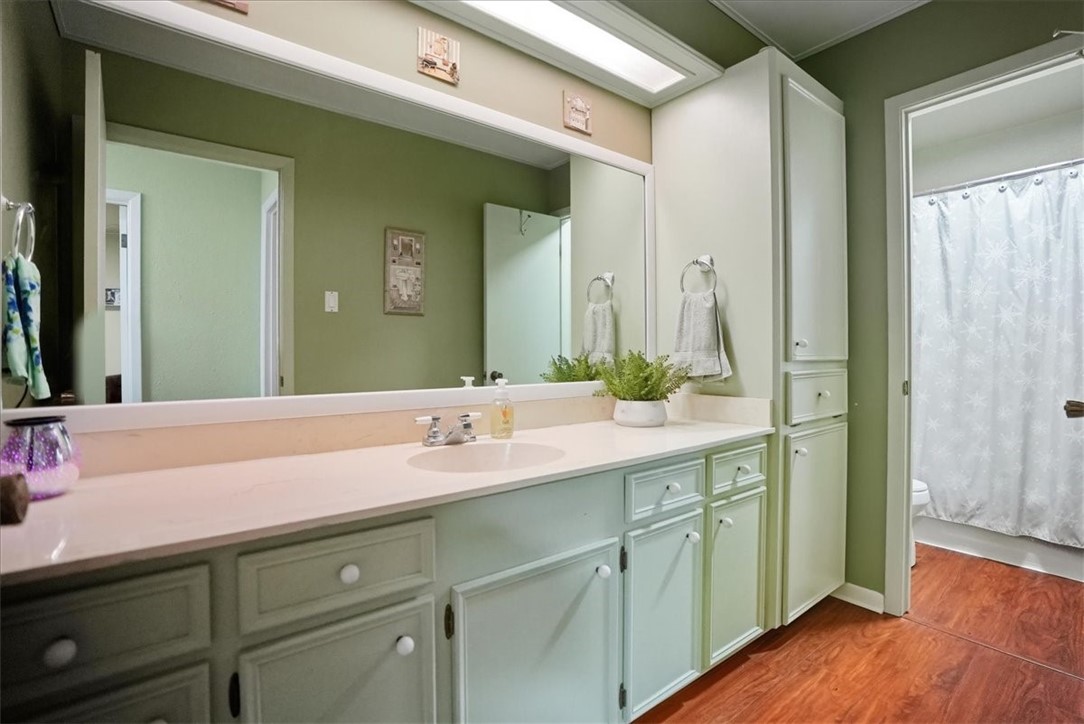 4218 Beard Drive Corpus Christi, TX 78413 - Photo 25 of 31 a bathroom with a sink and a mirror