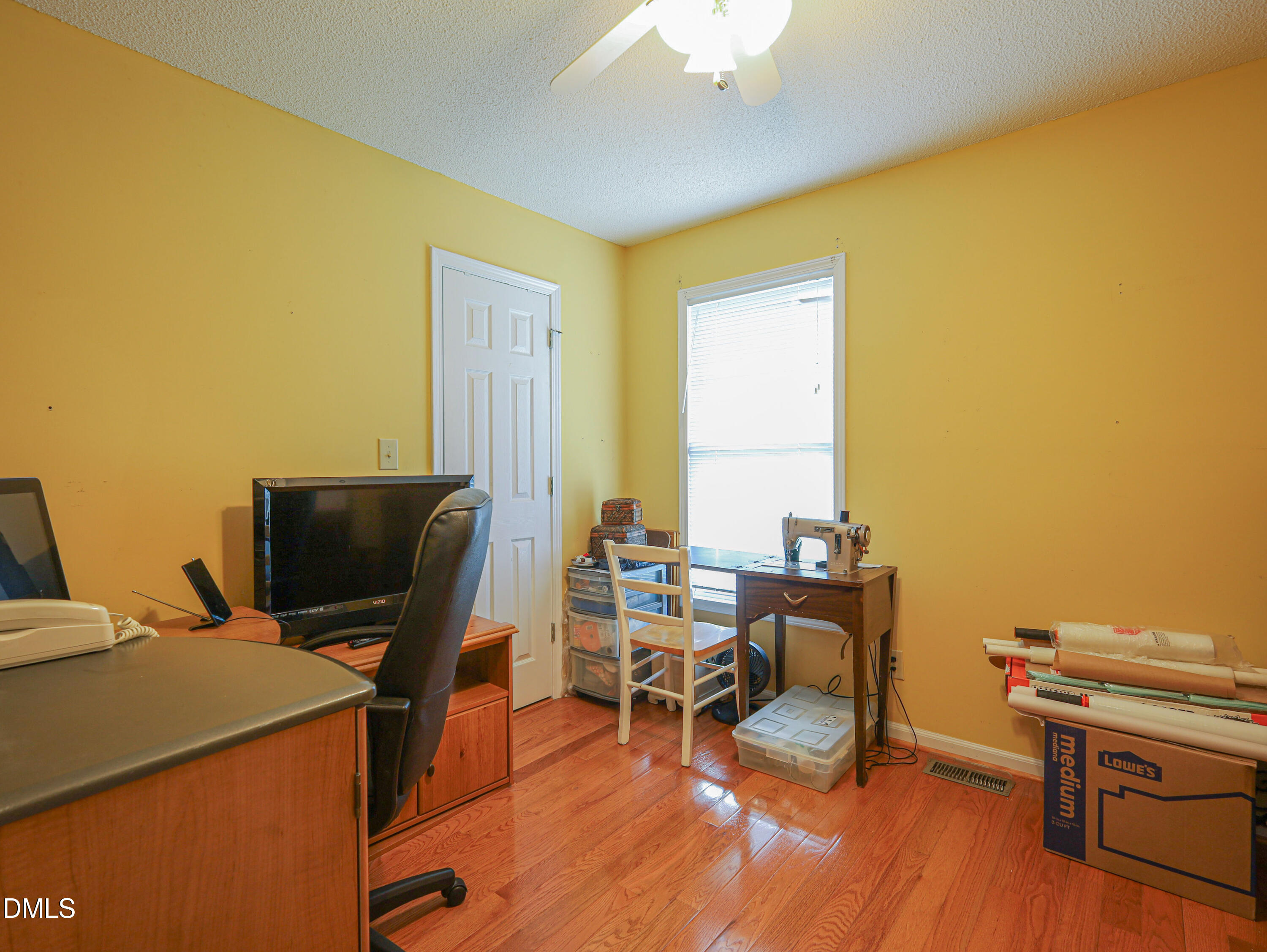 182 Scotts Lane Angier, NC 27501 - Photo 11 of 12 a view of a workspace with furniture and a window